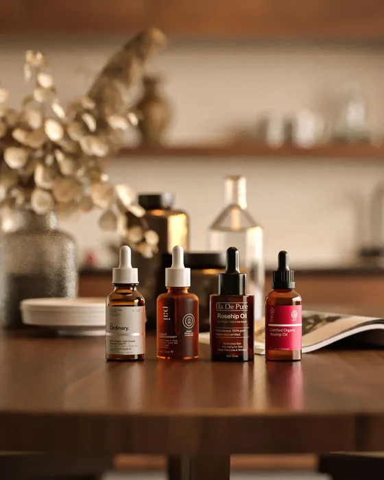 Amber serum bottles styled on a dark wooden table in warm light.