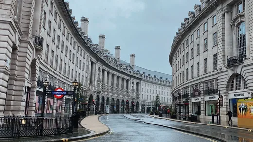 A wide, empty curve of Regent Street in London, the kind of pitch that has to be chosen and permitted in advance.